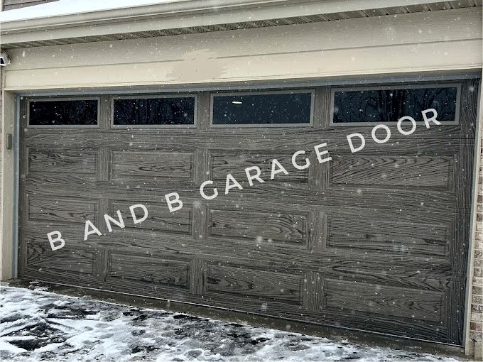 A luxurious dark wood double-wide garage door showcasing classic beauty and high-end curb appeal.